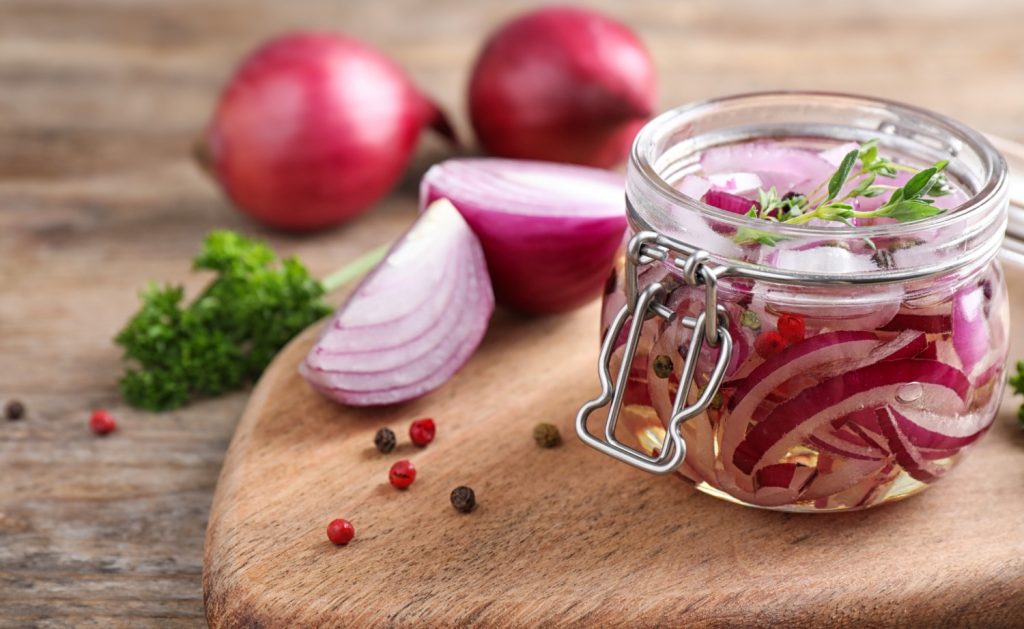 Jar of Grandma’s Pickled Red Onions made in my kitchen for www.homekitchengardens.com